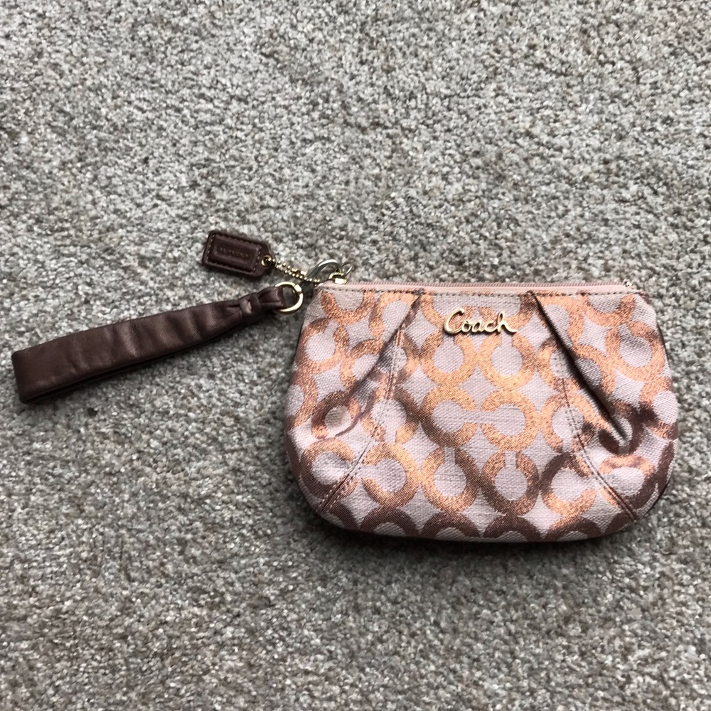 Rose gold Coach wristlet
